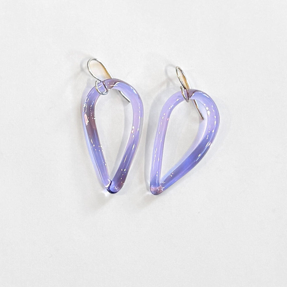 Pair of light purple teardrop-shaped earrings on a white background