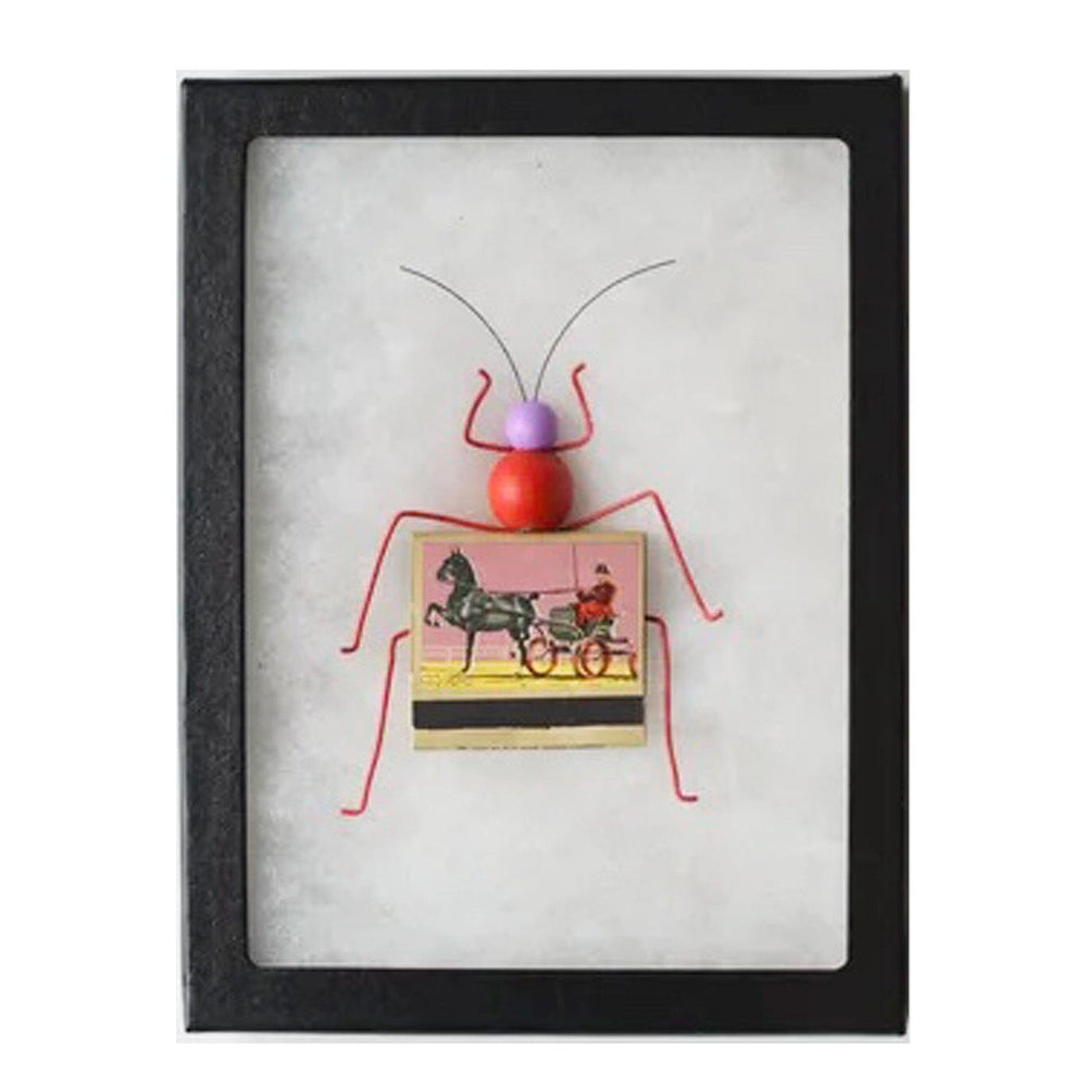 Framed artwork of a red bug with a matchbox body