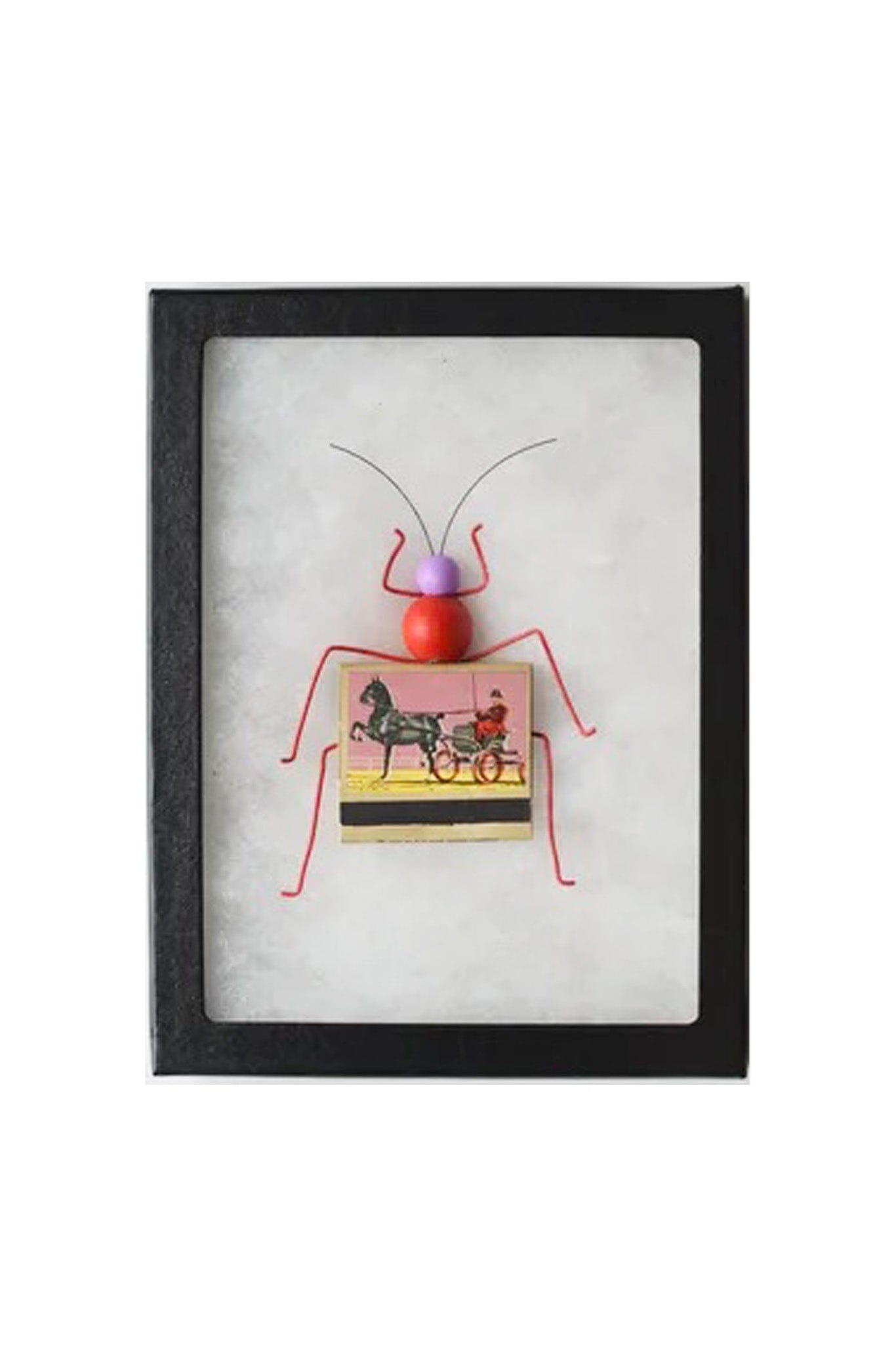 Framed artwork of a red bug with a matchbox body