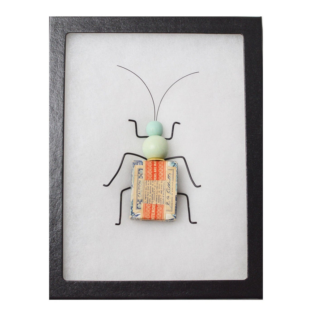 Framed artwork of a beetle-like insect on a white background