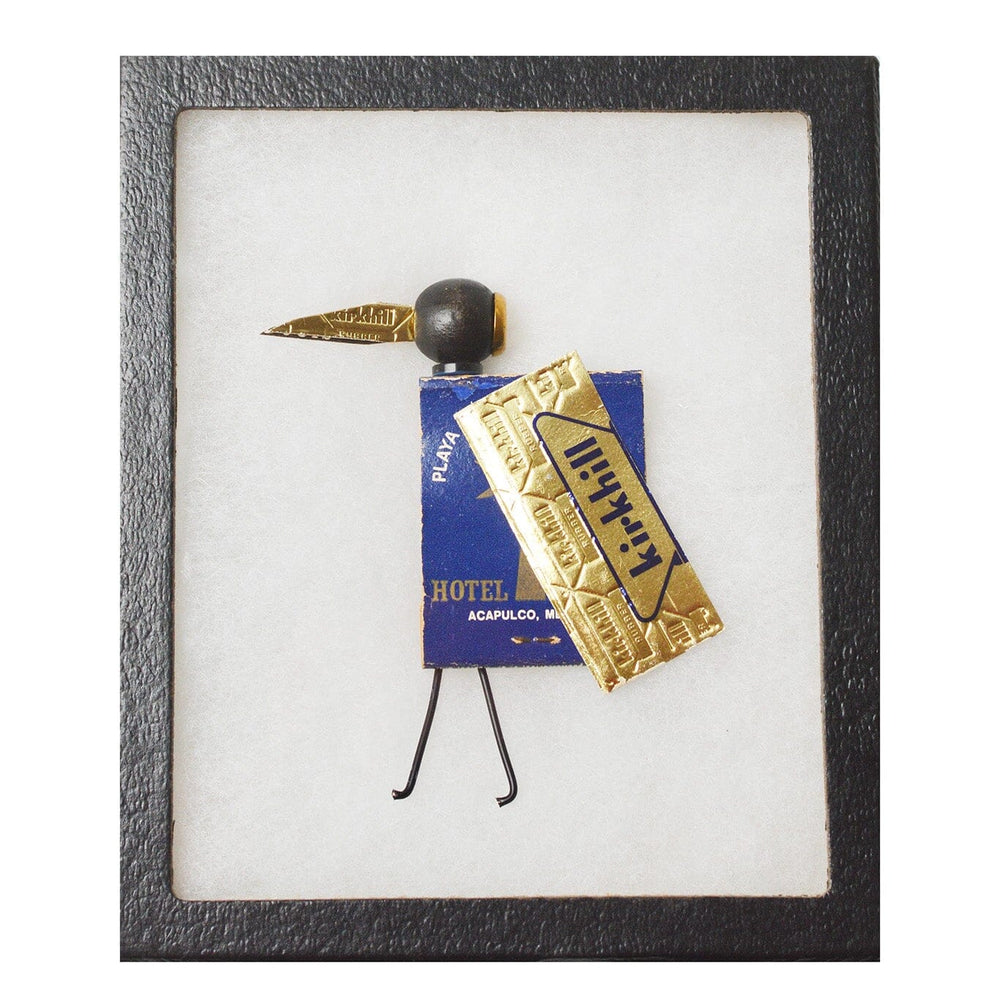 Framed art piece with a decorative object on a white background