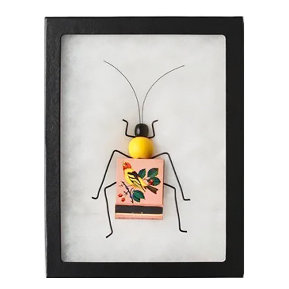 Framed artwork of a stylized insect with a colorful body on a white background