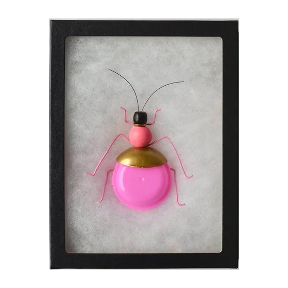 Framed artwork of a pink and gold beetle on a white background