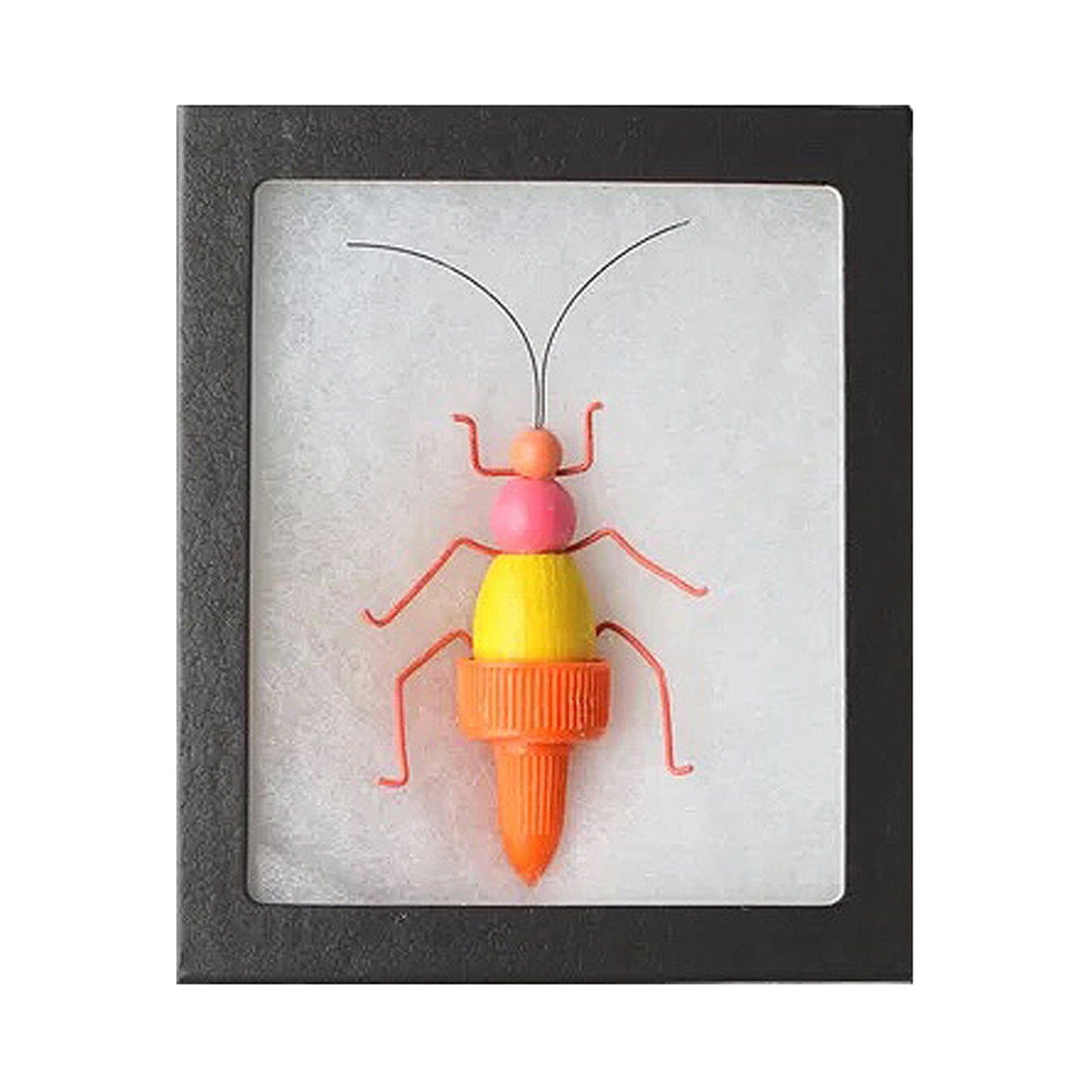 Colorful insect-shaped object in a black frame on a white background