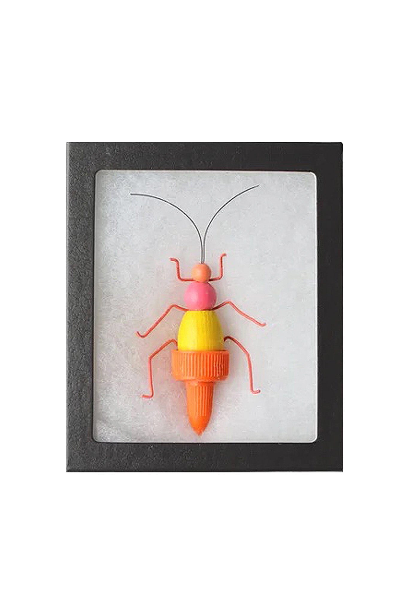Colorful insect-shaped object in a black frame on a white background