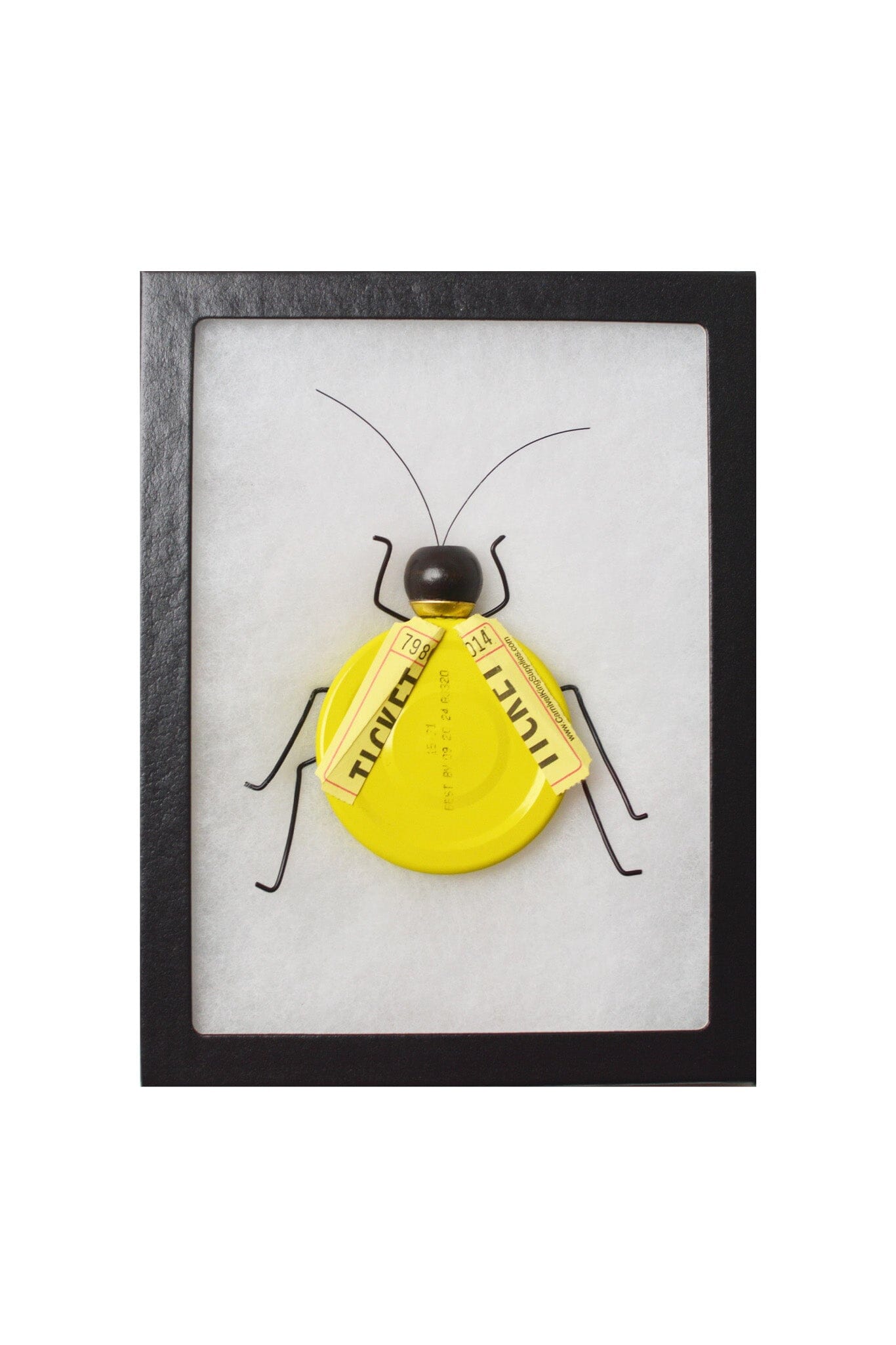 Framed artwork of a yellow insect with black antennae on a white background