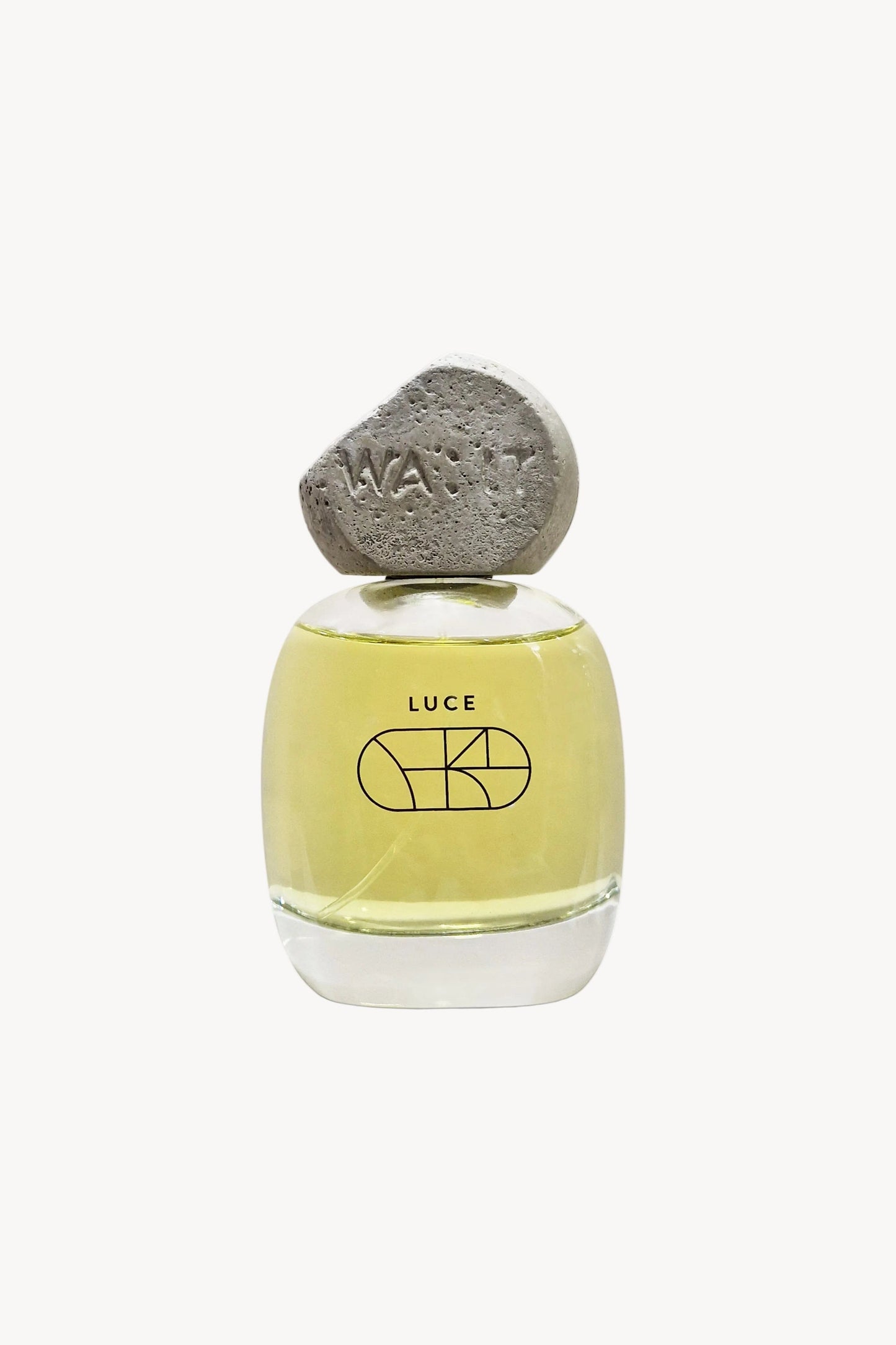 A bottle of LUCE Eau de Parfum with a yellowish liquid and a concrete cap, displayed against a white background.