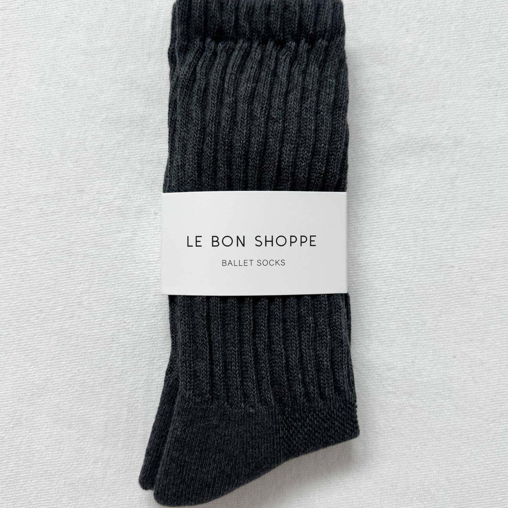 
                  
                    Dark gray ballet socks with a white label on a light gray background
                  
                