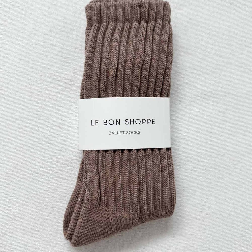 
                  
                    Pair of brown ballet socks with a 'Le Bon Shoppe' label on a light gray background
                  
                