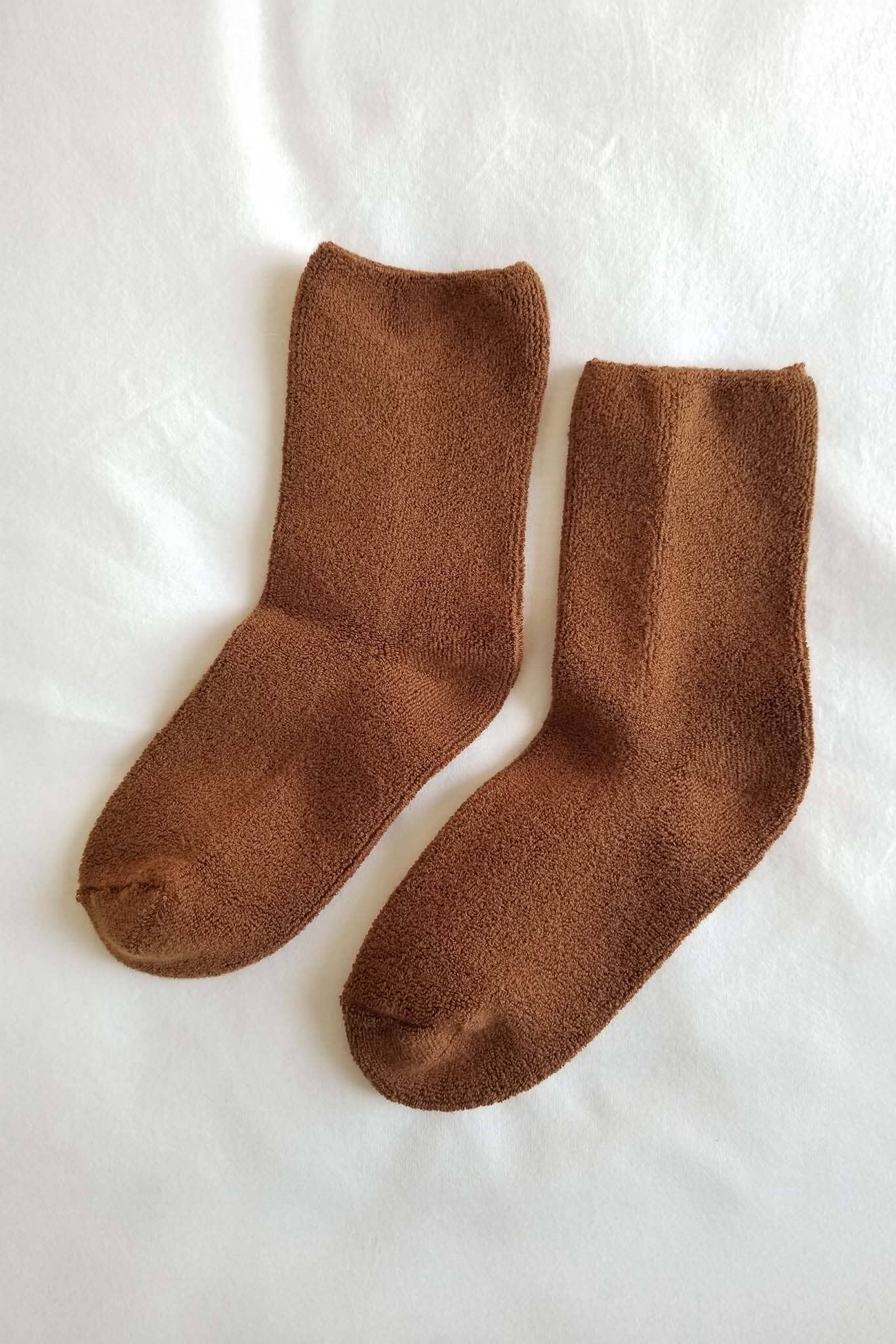 Pair of brown socks on a white background