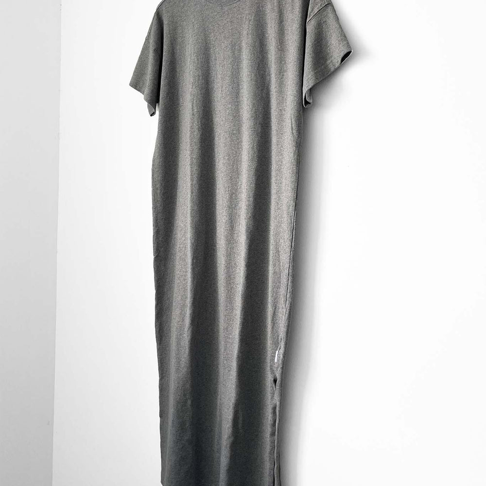 Gray dress on a hanger against a white background