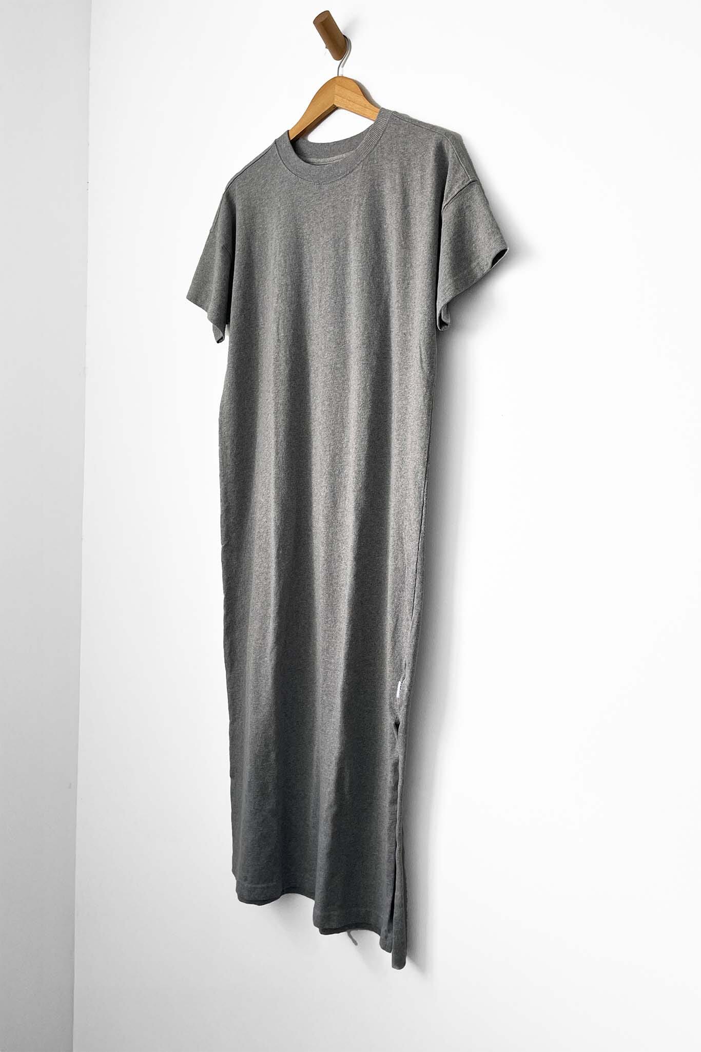 Gray dress on a hanger against a white background