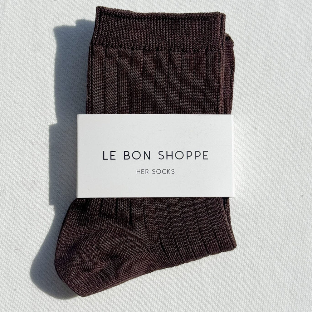 
                  
                    Pair of brown socks with a 'Le Bon Shoppe' label on a light gray background
                  
                