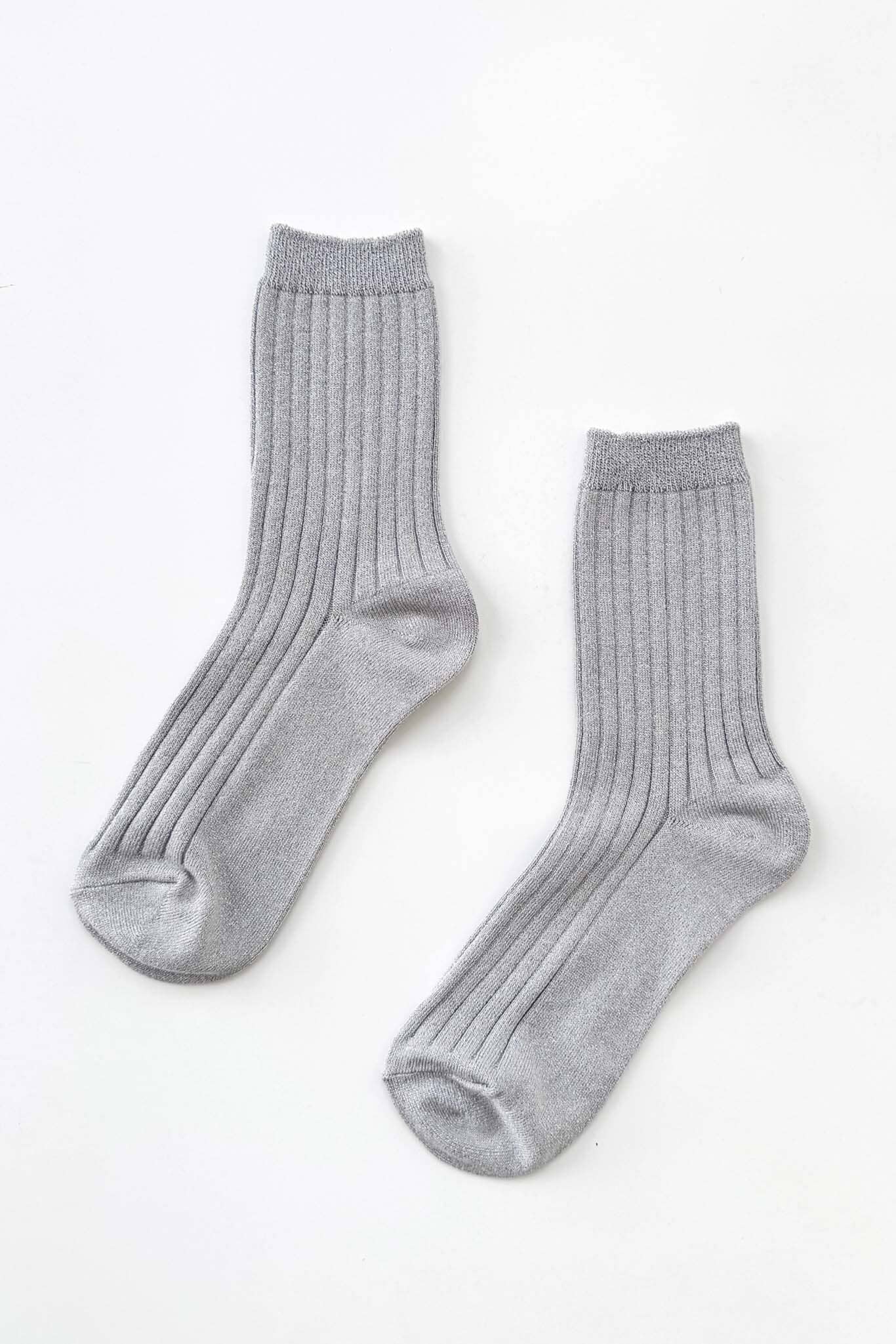 Pair of silver gray socks on a white background.