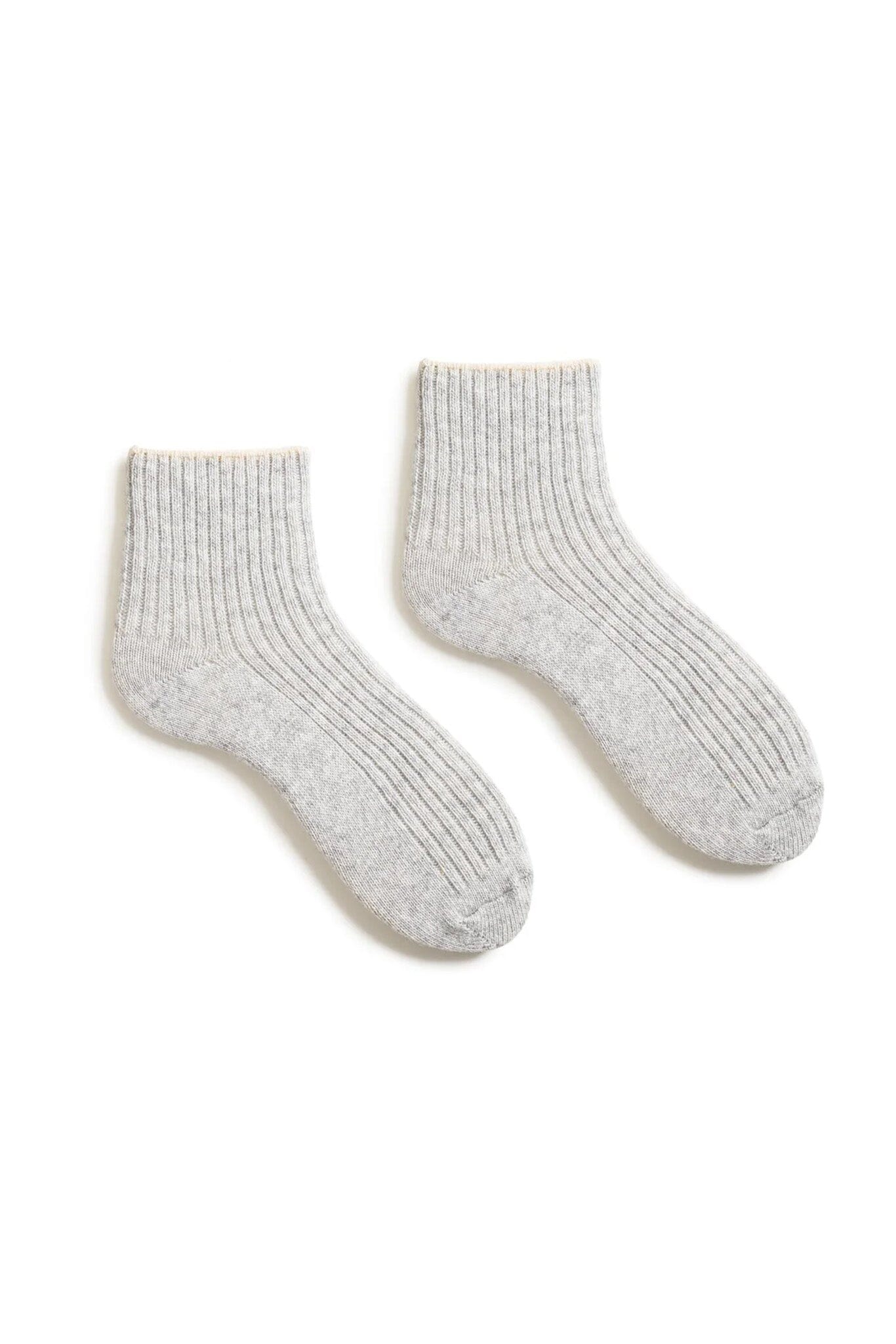 Pair of gray cashmere and wool socks on a white background