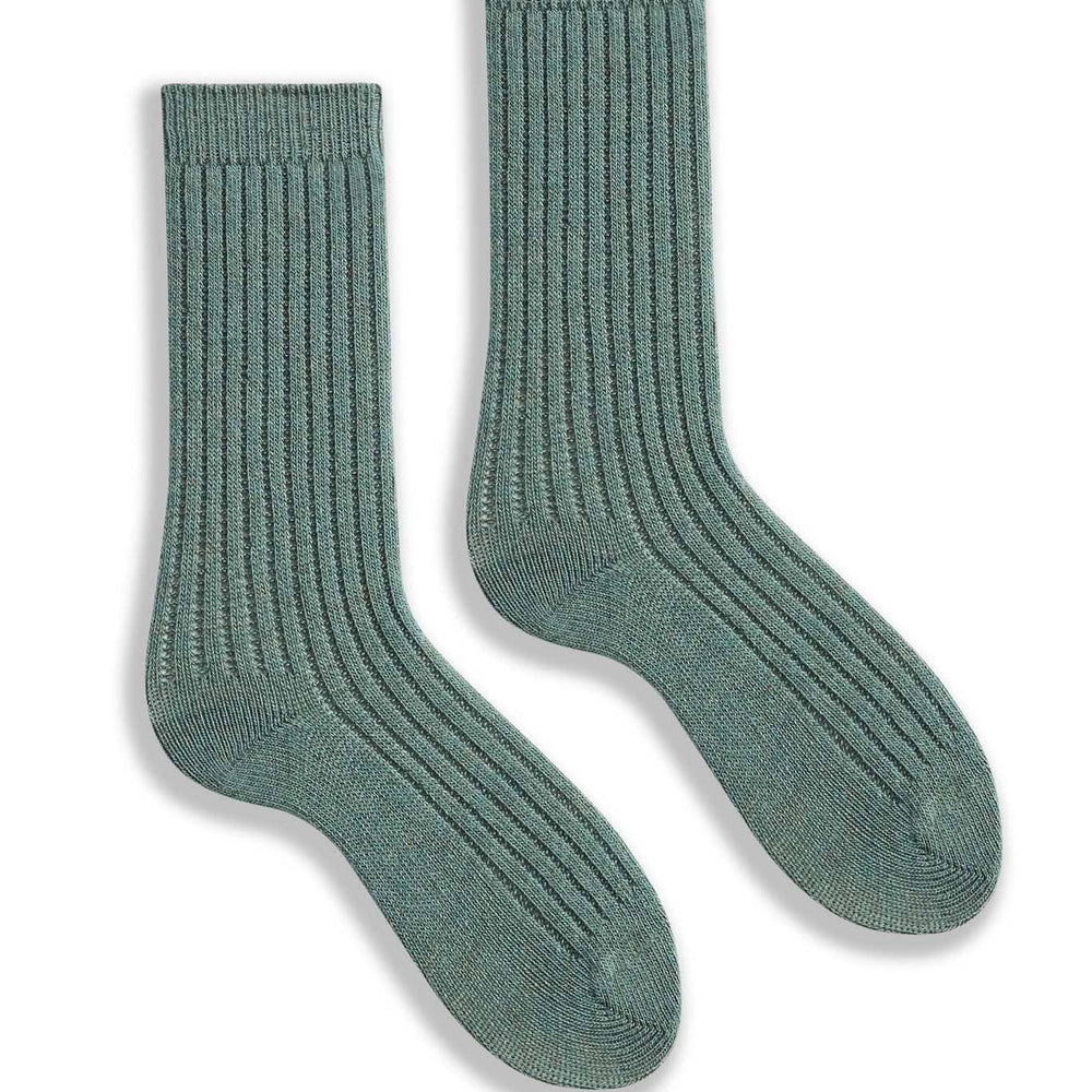 Pair of mineral green ribbed socks on a white background