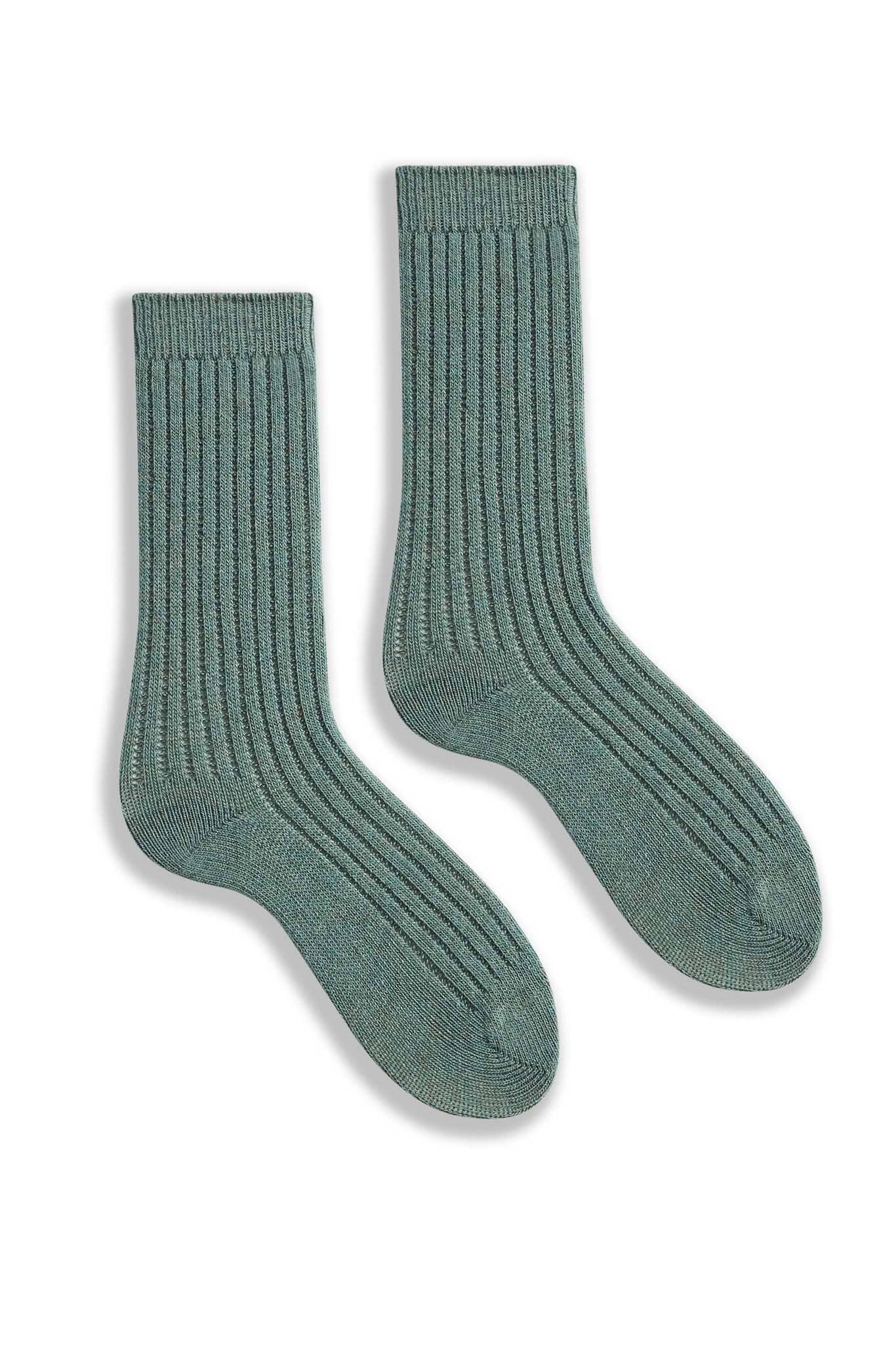 Pair of mineral green ribbed socks on a white background