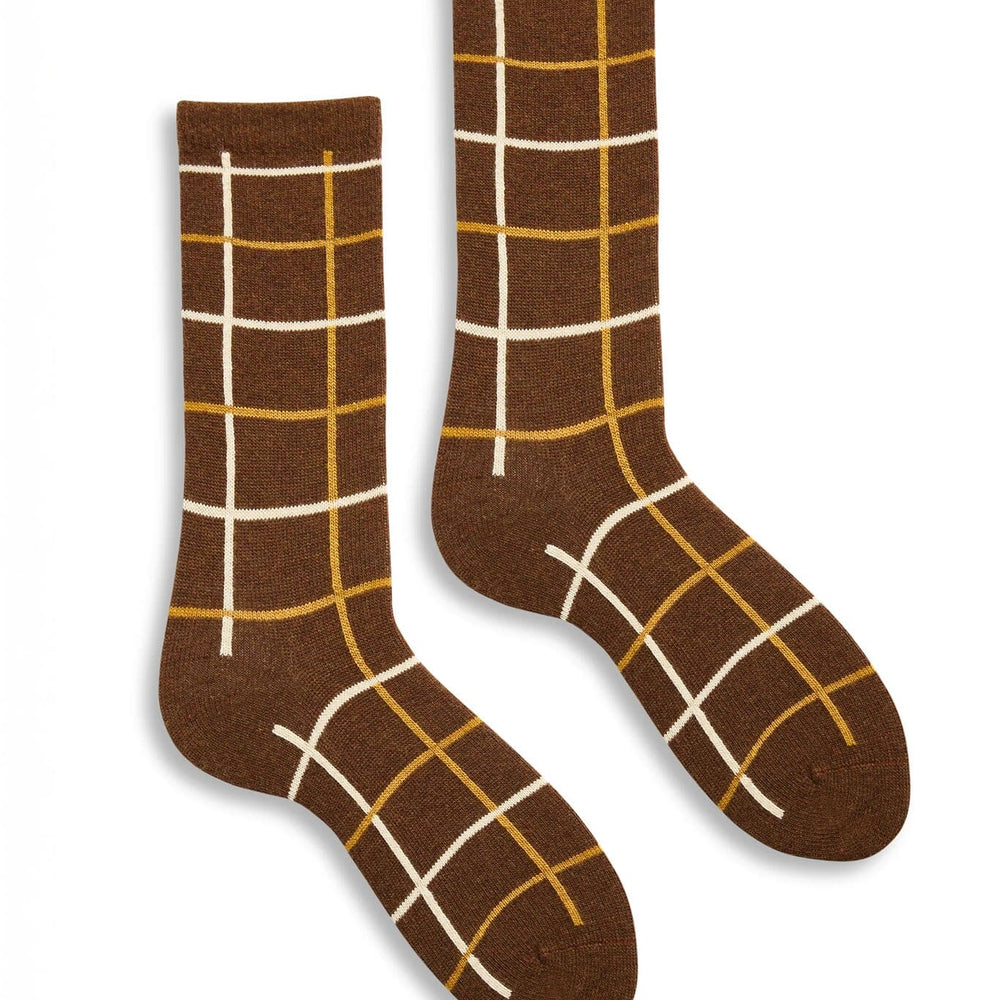 Pair of brown socks with white and gold grid pattern on a white background