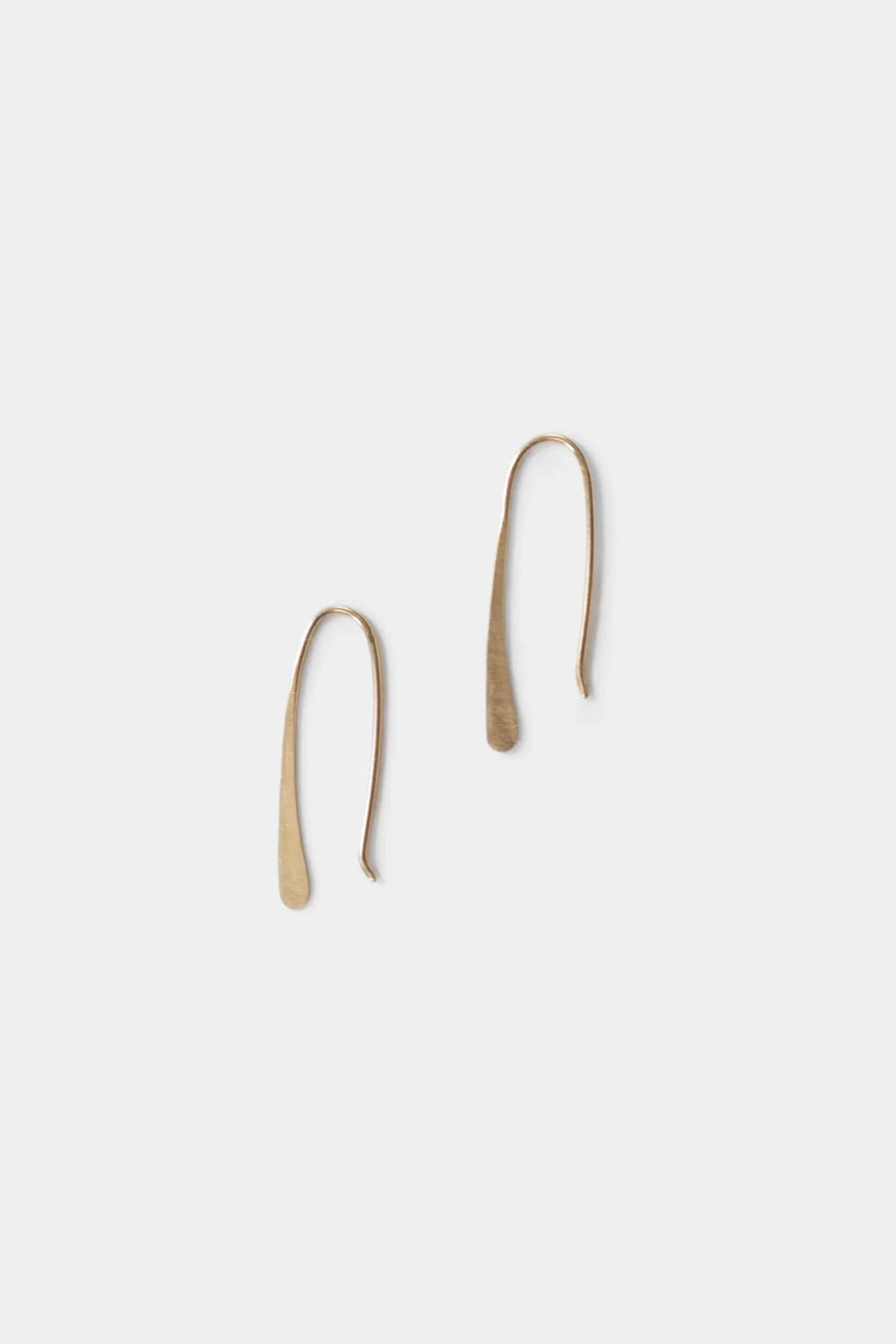 Pair of gold hoop earrings on a white background