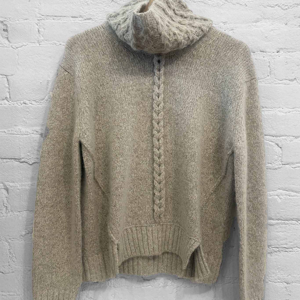 
                  
                    A beige knit long sleeve wool and cashmere sweater paired with a grey knit funnelneck scarf
                  
                