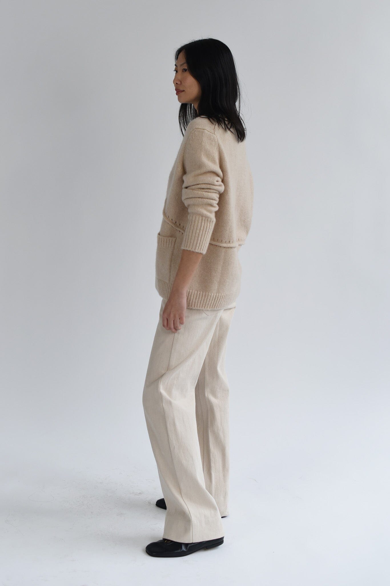 Wool and cashmere long sleeve sweater on a white background.