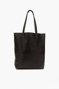 Black leather tote bag on a white background