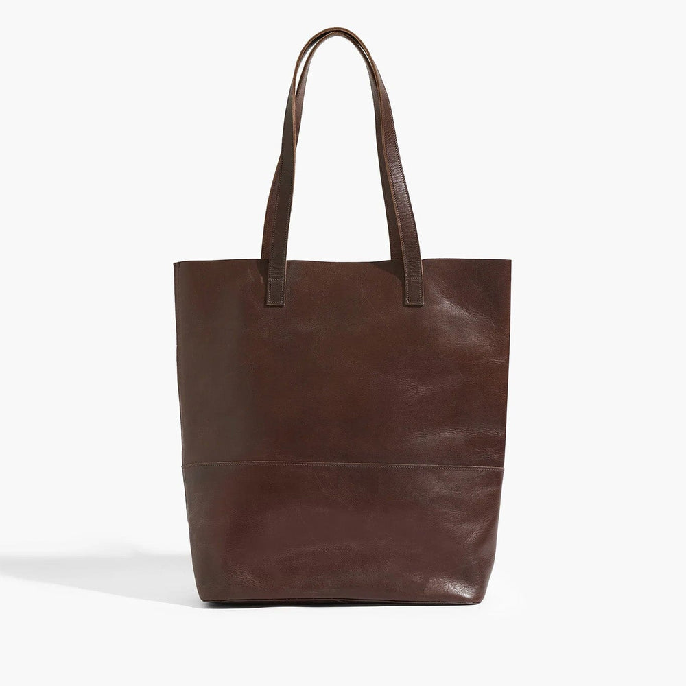 Brown leather tote bag on a white background