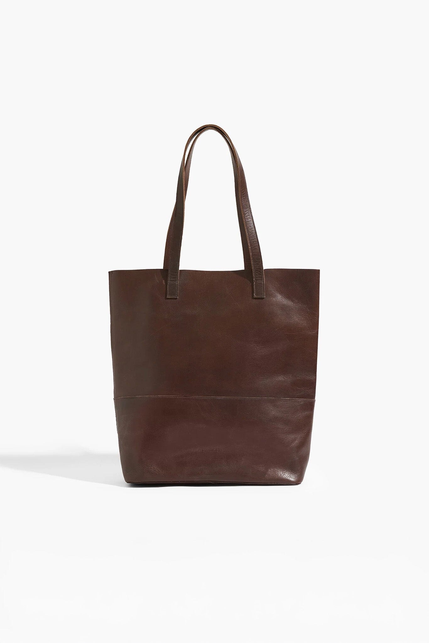 Brown leather tote bag on a white background