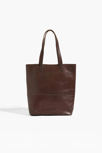 Brown leather tote bag on a white background