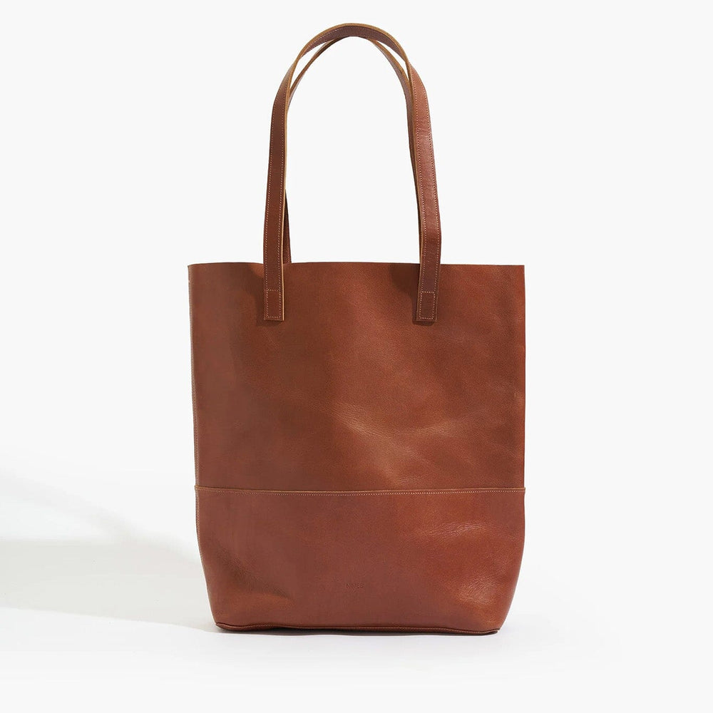 Brown leather tote bag on a white background