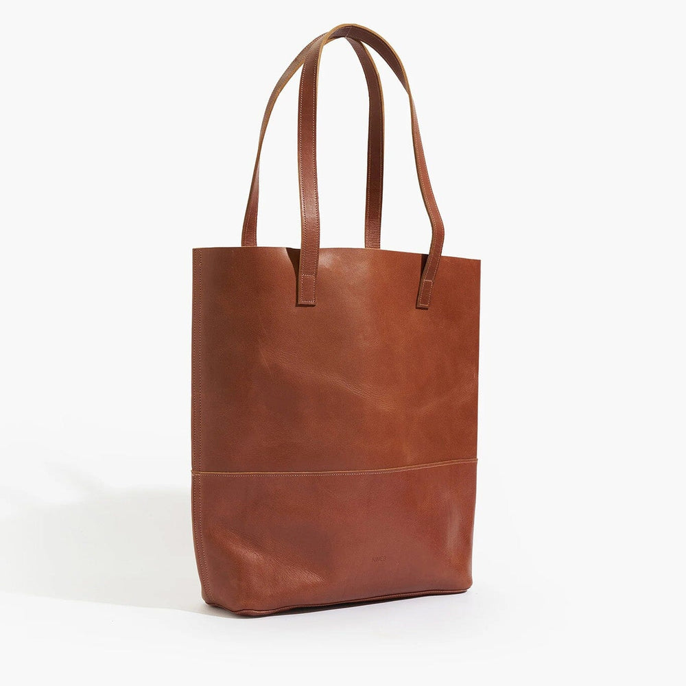 Brown leather tote bag on a white background