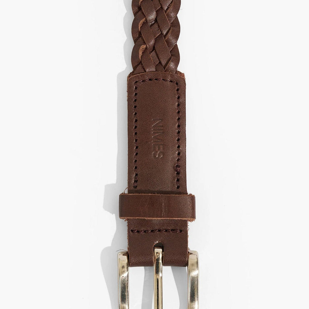 Brown braided leather belt with a silver buckle on a white background