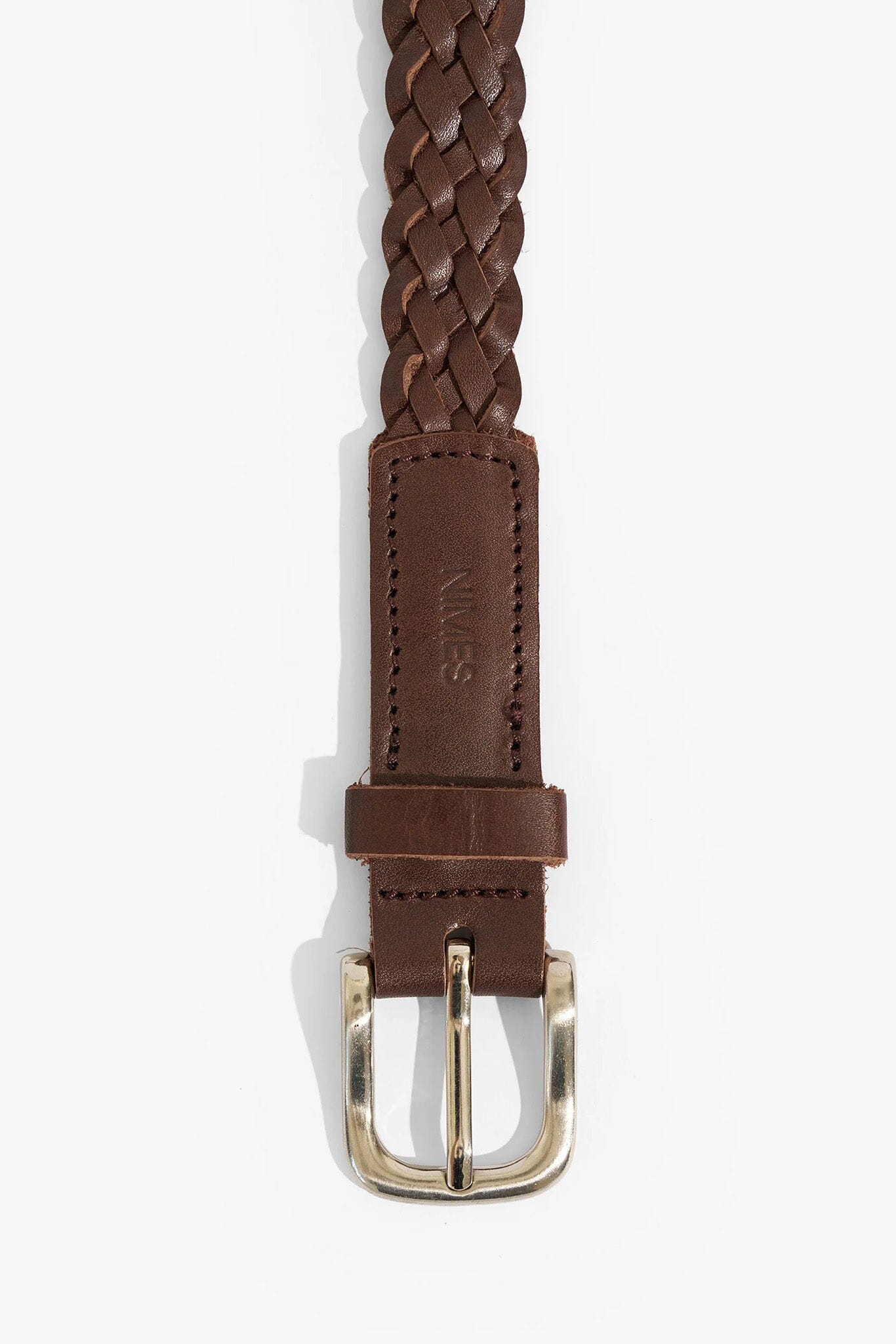Brown braided leather belt with a silver buckle on a white background