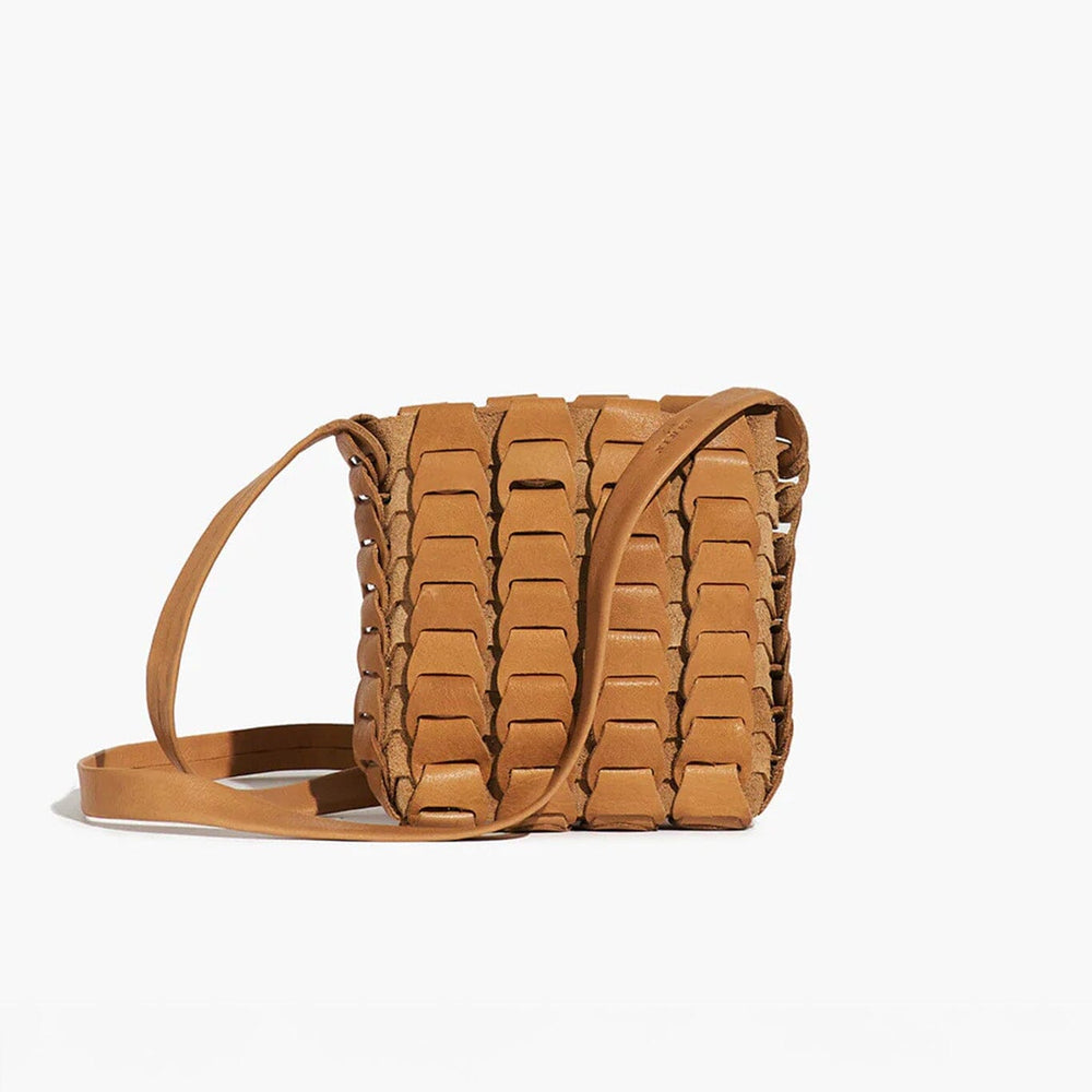 Brown woven handbag on a white background