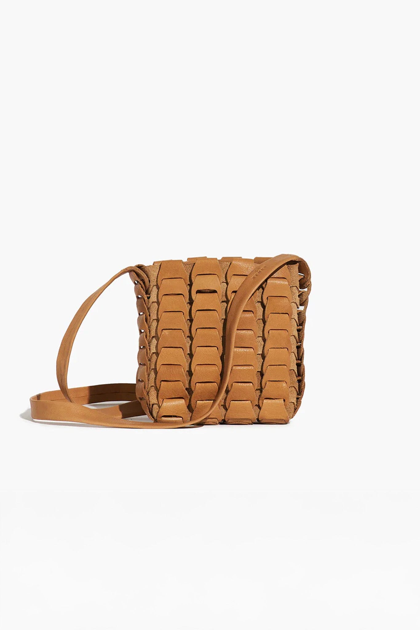 Brown woven handbag on a white background
