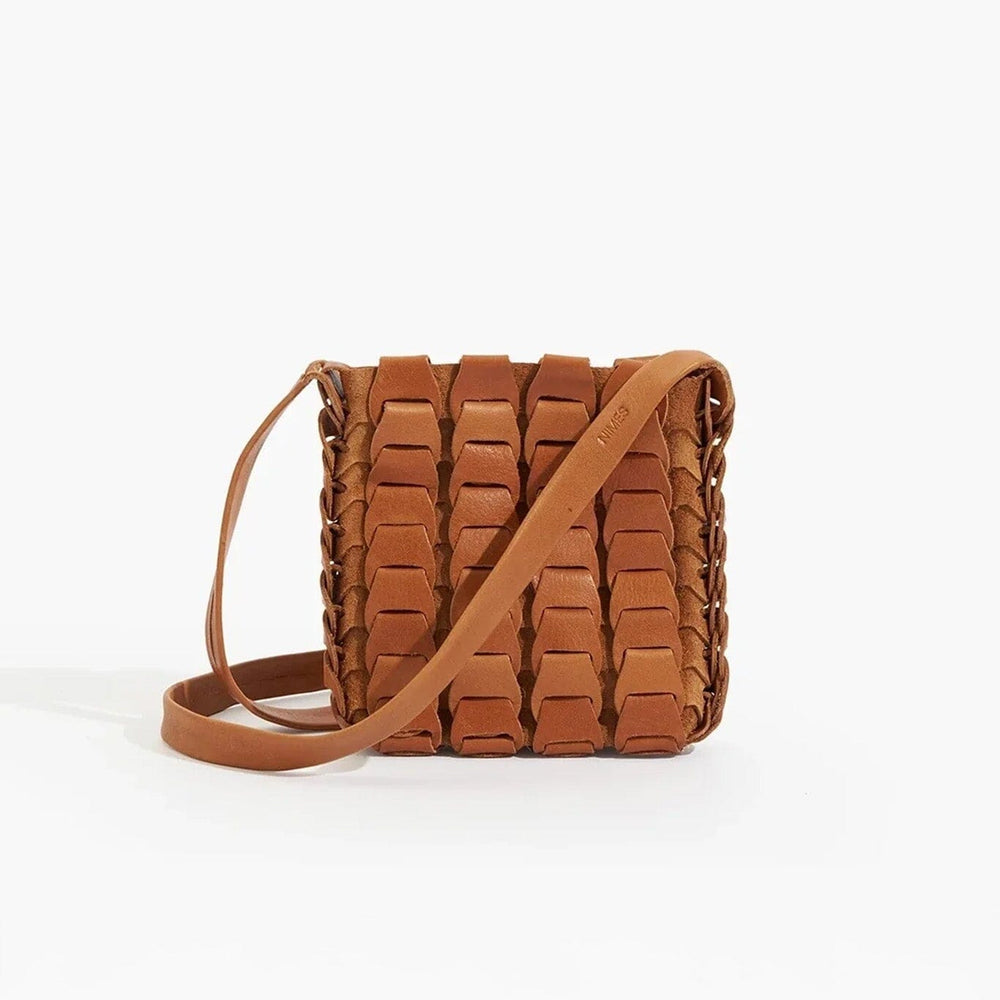 
                  
                    Brown woven handbag on a white background
                  
                
