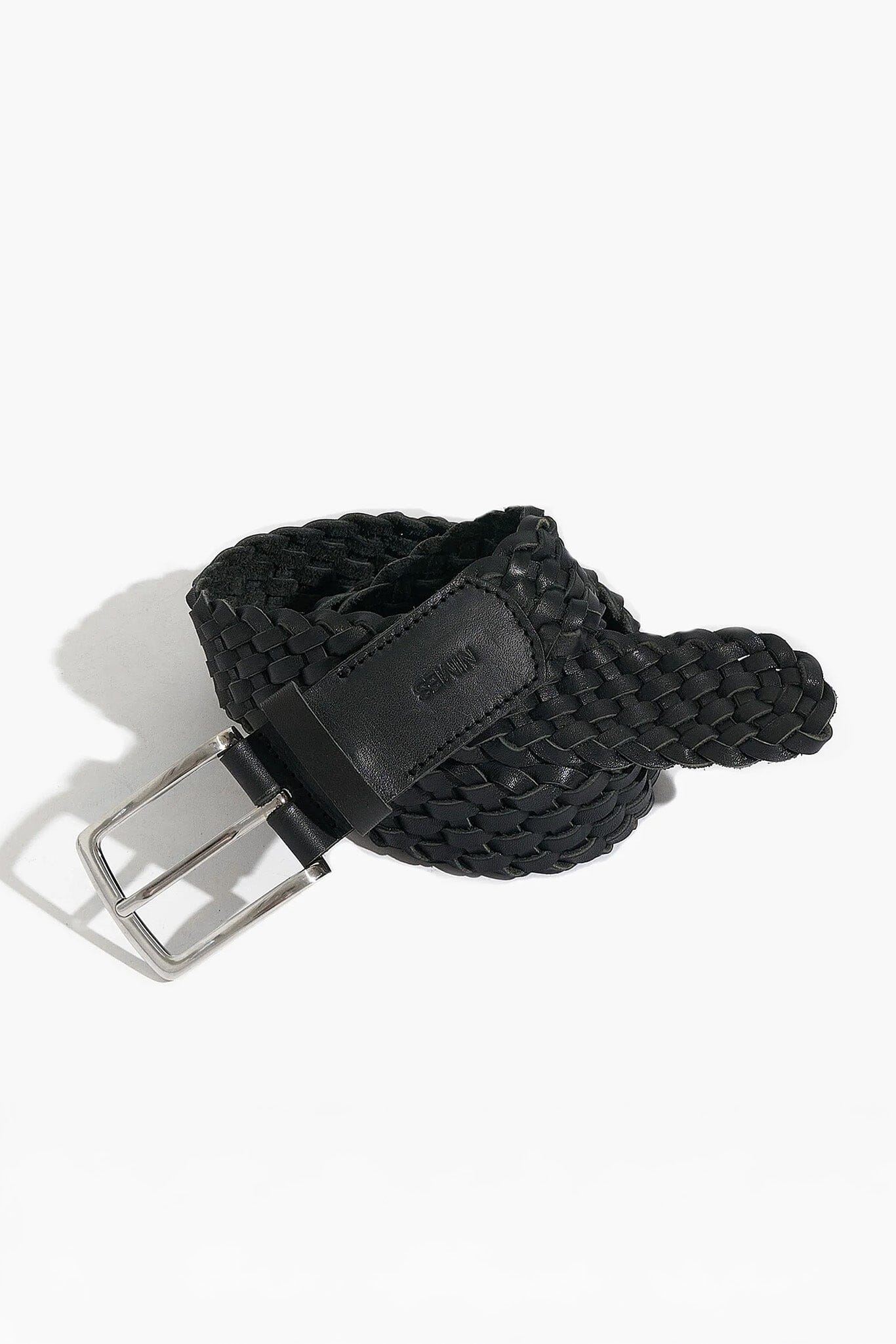 Black woven belt with a silver buckle on a white background