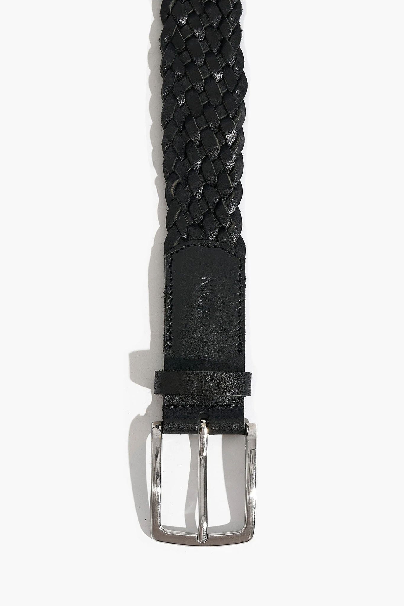 Black woven belt with silver buckle on a white background