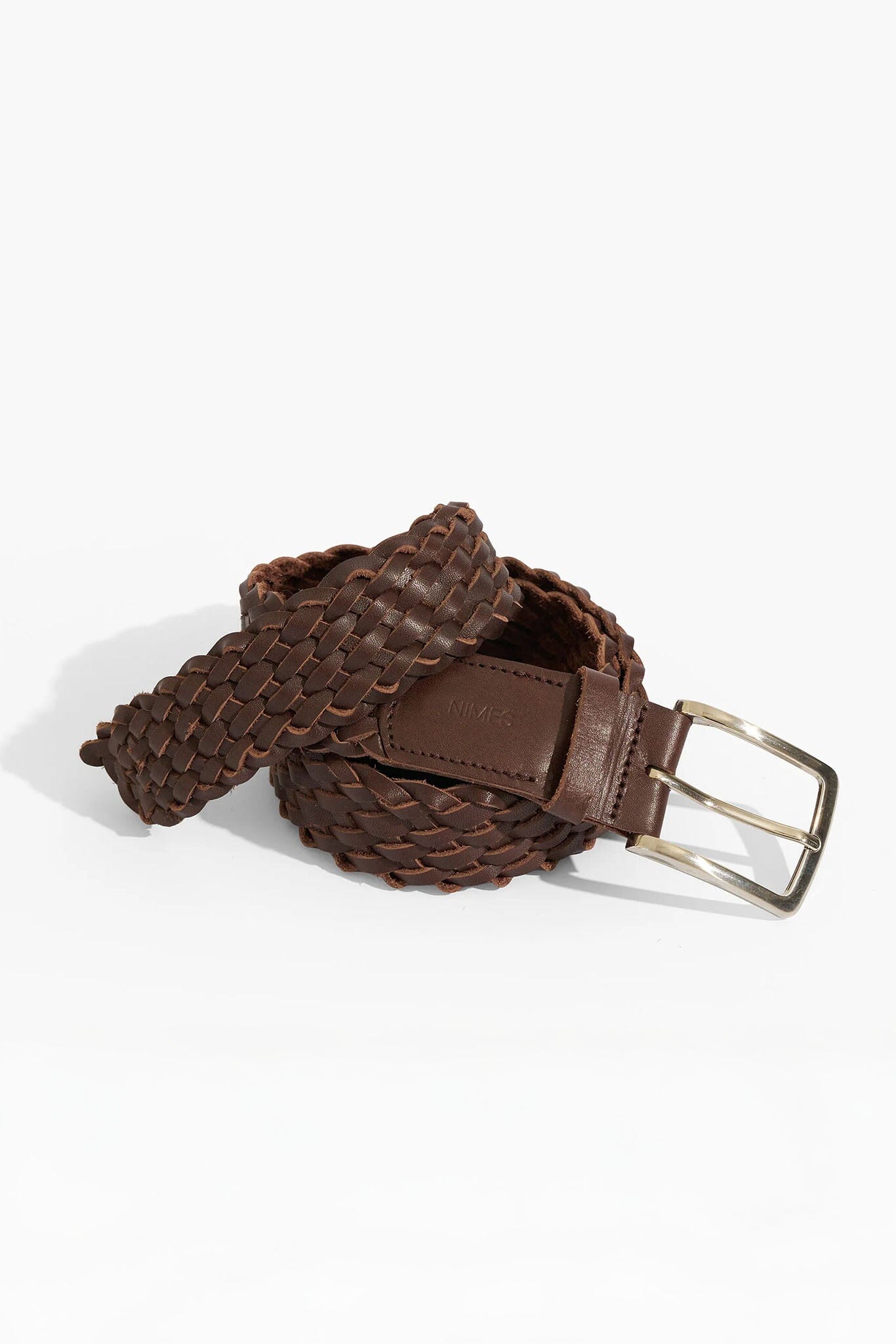 Brown woven belt with a silver buckle on a white background
