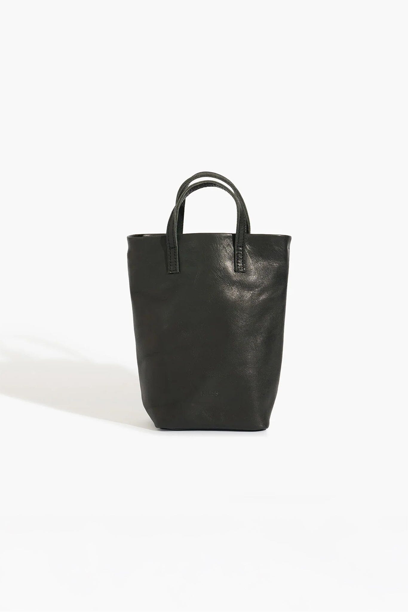 Black leather tote bag on a white background