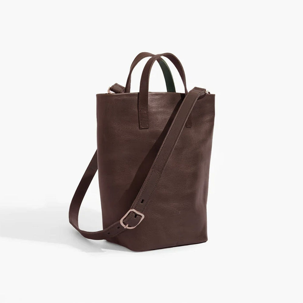 Brown leather tote bag with a shoulder strap on a white background