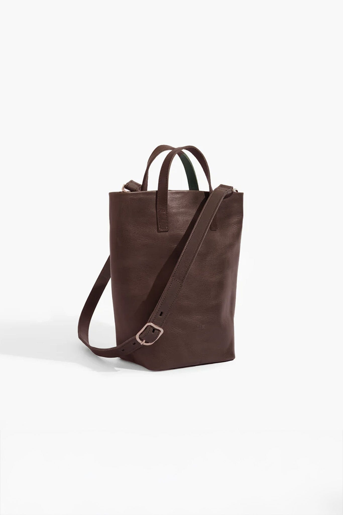 Brown leather tote bag with a shoulder strap on a white background