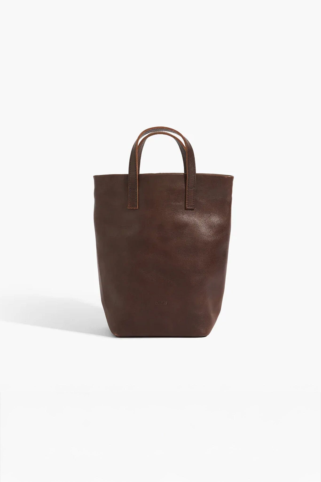 Brown leather tote bag on a white background