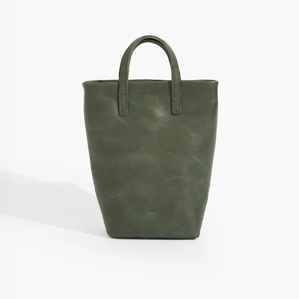 Green leather tote bag on a white background