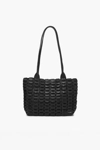 Black woven handbag on a white background