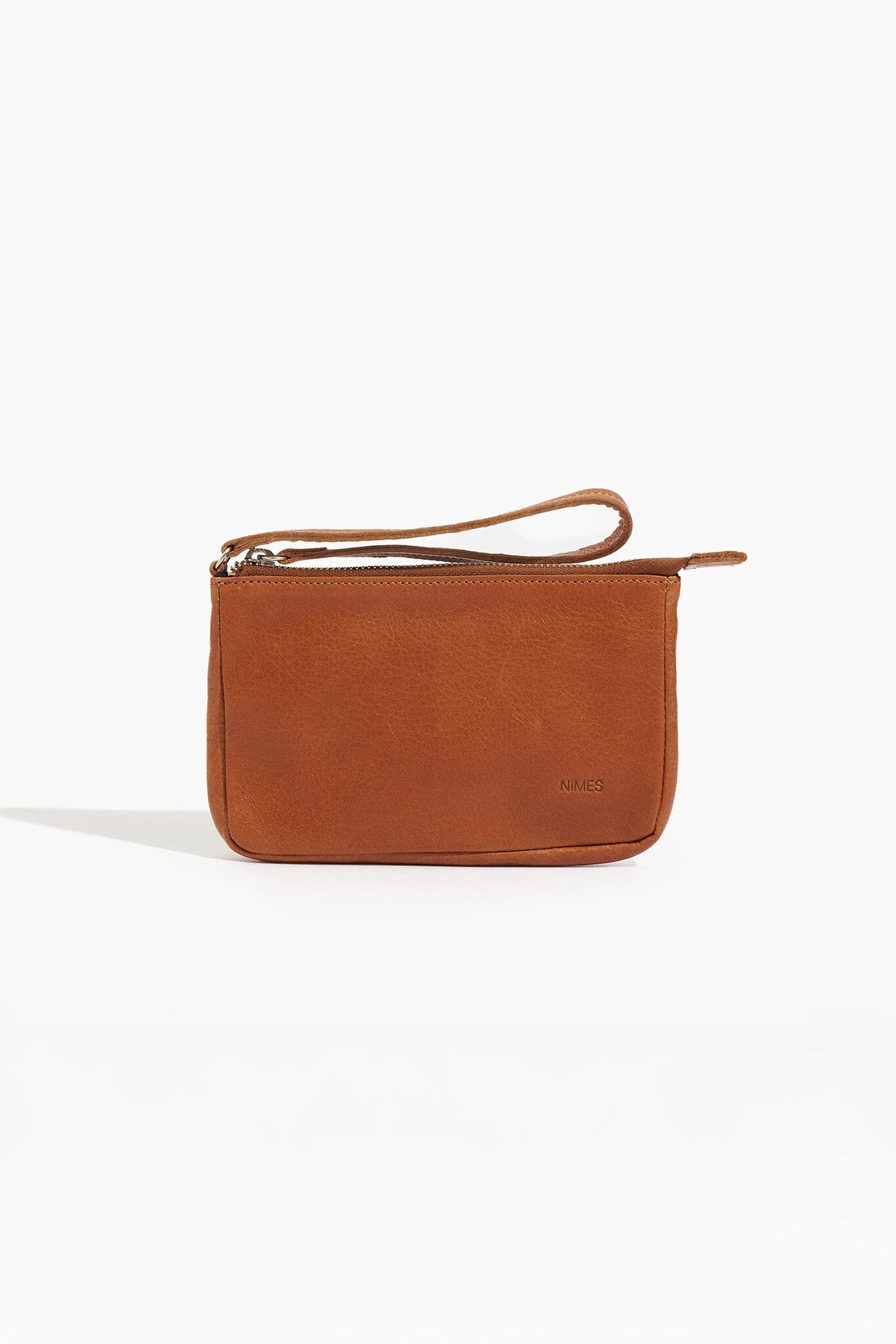 Brown leather clutch bag on a white background