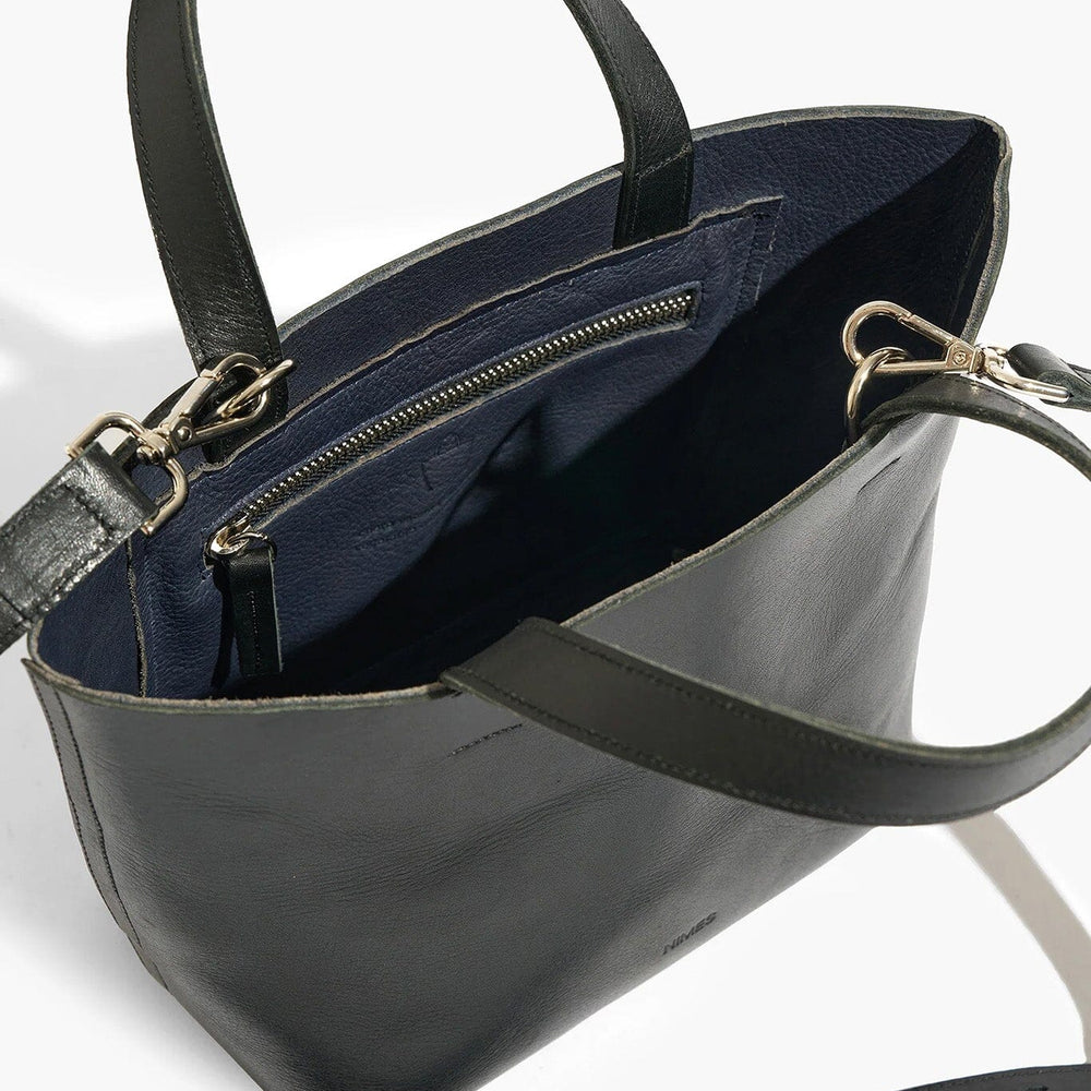 
                  
                    Black handbag with a visible interior on a white background
                  
                