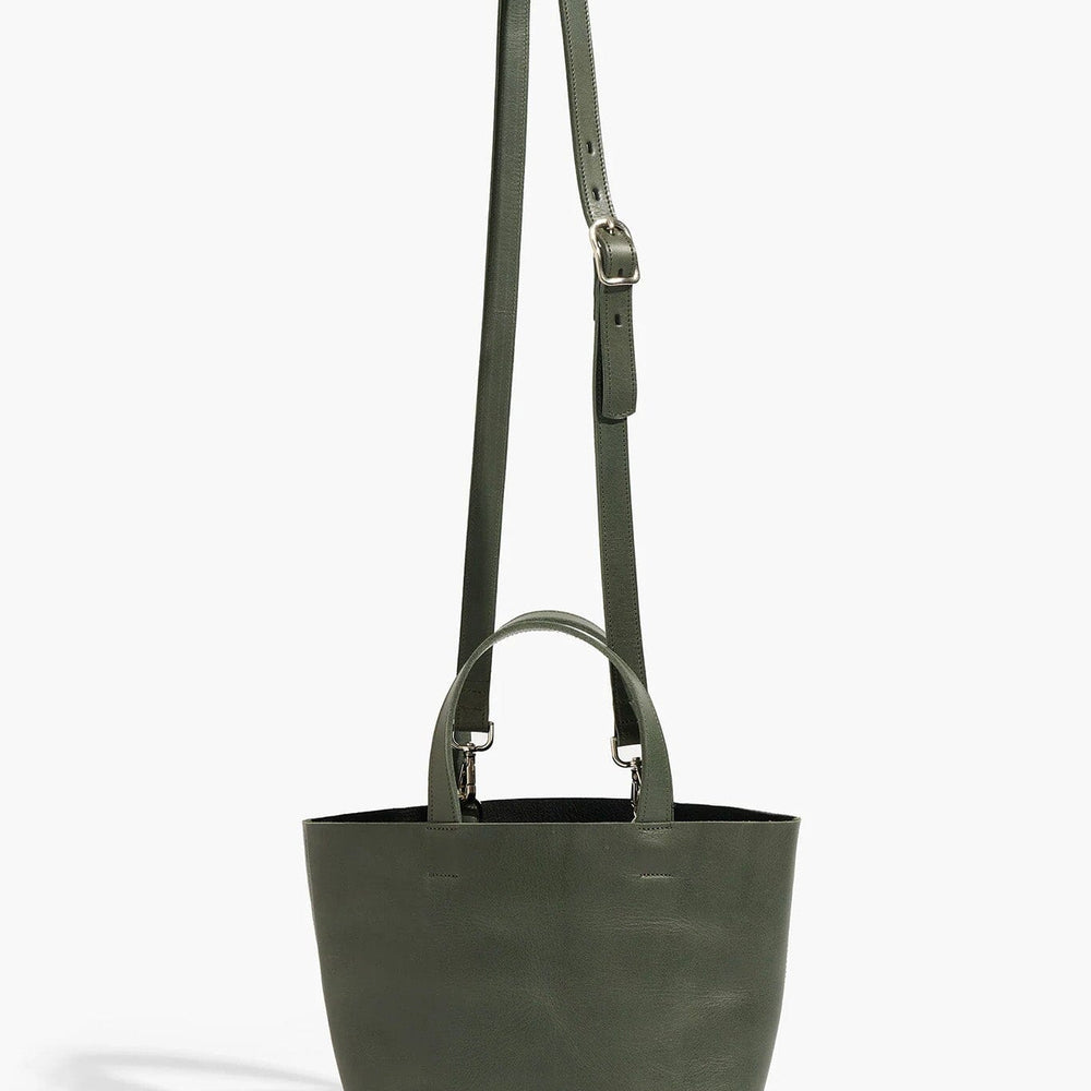 Green tote bag with a long strap on a white background