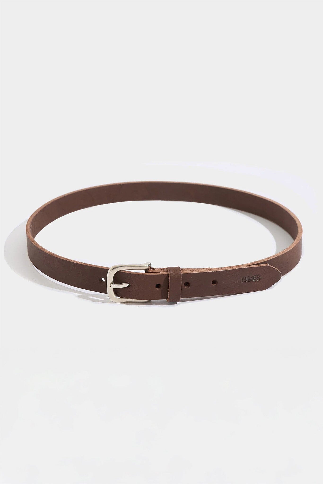 Brown leather belt with a silver buckle on a white background
