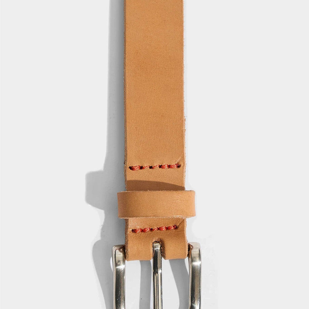 Tan leather belt with a silver buckle on a white background